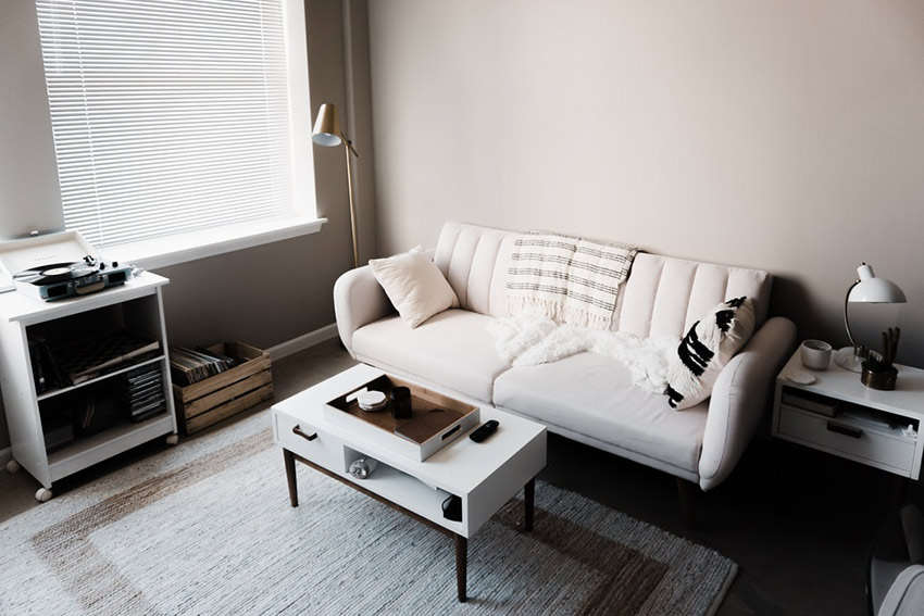 an image of a lounge room with white furniture